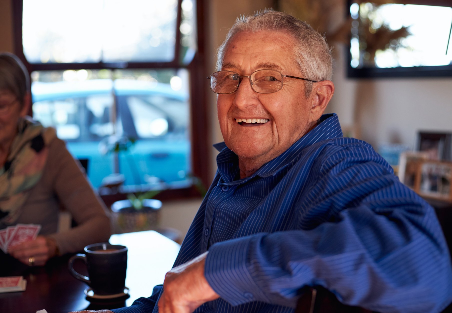 Senior Couple at Home Playing Cards Together